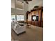 Vaulted living room featuring a large entertainment center, neutral sofa, and bright windows at 5381 W Del Rio St, Chandler, AZ 85226
