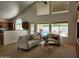 Bright living room showcasing vaulted ceilings, an open kitchen and access to the backyard pool at 5381 W Del Rio St, Chandler, AZ 85226