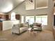Bright and airy living room with views of the pool and access to the kitchen at 5381 W Del Rio St, Chandler, AZ 85226