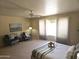Bright and inviting main bedroom with a ceiling fan and neutral color scheme at 5381 W Del Rio St, Chandler, AZ 85226