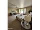 Bright main bedroom featuring neutral carpet, seating area, and stylish decor at 5381 W Del Rio St, Chandler, AZ 85226