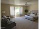 Spacious main bedroom with a ceiling fan, neutral carpet, and a bright window at 5381 W Del Rio St, Chandler, AZ 85226