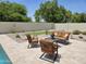 Tranquil pool area with lounge chairs, lush landscaping, and a privacy wall for relaxation at 5381 W Del Rio St, Chandler, AZ 85226