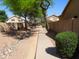 Neighborhood walking path with lush green trees on a sunny day at 5381 W Del Rio St, Chandler, AZ 85226