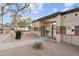 Community gate with key entry, rock landscaping and well maintained foliage in a residential neighborhood at 5824 E Hoover Ave, Mesa, AZ 85206