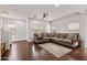 Cozy living room with hardwood floors, a comfortable sectional sofa, and ample natural light at 5824 E Hoover Ave, Mesa, AZ 85206