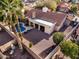 Aerial view of a single-Gathering home showcasing a backyard pool, covered patio, and desert landscaping at 6118 E Star Valley St, Mesa, AZ 85215