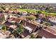 Scenic aerial view of a neighborhood showcasing homes near a lush golf course, perfect for outdoor enthusiasts at 6118 E Star Valley St, Mesa, AZ 85215