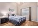 Bright bedroom featuring a metal bed frame, side table, and modern wall art at 6118 E Star Valley St, Mesa, AZ 85215