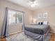 Cozy bedroom with neutral walls, patterned rug, and ample natural light from the window at 6118 E Star Valley St, Mesa, AZ 85215