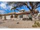 Charming single-story home with a three-car garage and desert landscaping at 6118 E Star Valley St, Mesa, AZ 85215