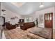 Open-concept living room with tile floors, leather furniture, and natural light at 6118 E Star Valley St, Mesa, AZ 85215