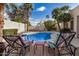 Relaxing backyard oasis with a sparkling pool and comfortable lounge chairs for enjoying the sunny days at 6118 E Star Valley St, Mesa, AZ 85215