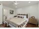 Inviting bedroom features a soft color palette, plush bedding, and hardwood floors at 619 E Jensen St # 80, Mesa, AZ 85203