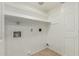 Well lit laundry room with shelves and tiled floors at 619 E Jensen St # 80, Mesa, AZ 85203