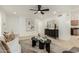 Bright living room boasting contemporary furniture, a ceiling fan, and a seamless flow to adjacent spaces at 619 E Jensen St # 80, Mesa, AZ 85203