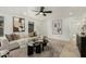 Bright living room featuring neutral paint, contemporary furniture, a ceiling fan, and stylish decorative accents at 619 E Jensen St # 80, Mesa, AZ 85203