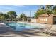 Inviting community pool with lounge chairs and a covered area for residents' enjoyment and relaxation at 619 E Jensen St # 80, Mesa, AZ 85203