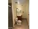 Cozy bathroom features a single vanity, toilet, and a glass-enclosed shower at 6437 W Devonshire Ave, Phoenix, AZ 85033