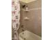 Cozy bathroom featuring a tub with shower and decorative shower curtain at 6437 W Devonshire Ave, Phoenix, AZ 85033