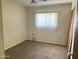 Cozy bedroom with a window providing natural light and a ceiling fan at 6437 W Devonshire Ave, Phoenix, AZ 85033