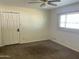 Bright bedroom featuring neutral walls, a ceiling fan and a window with blinds at 6437 W Devonshire Ave, Phoenix, AZ 85033