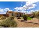 Backyard featuring landscaped yard, a covered patio with outdoor seating and turf at 6634 S Pinnacle Ct, Chandler, AZ 85249