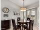 Cozy dining area with a round table, comfortable seating, and natural light at 6634 S Pinnacle Ct, Chandler, AZ 85249