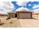 Charming single-story home featuring a spacious two car garage and desert landscaping at 6634 S Pinnacle Ct, Chandler, AZ 85249