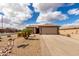 Charming single-story home with a well-manicured desert landscape and a spacious two car garage at 6634 S Pinnacle Ct, Chandler, AZ 85249