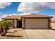 Charming single-story home featuring a spacious two car garage and desert landscaping at 6634 S Pinnacle Ct, Chandler, AZ 85249