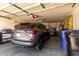 Spacious garage featuring an SUV parked inside with storage shelves at 6634 S Pinnacle Ct, Chandler, AZ 85249