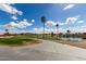 Scenic view of golf course featuring a pond, green fairways, and a picturesque landscape at 6634 S Pinnacle Ct, Chandler, AZ 85249