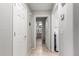 Hallway view with doors leading to various rooms including a bathroom and laundry room at 6634 S Pinnacle Ct, Chandler, AZ 85249