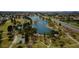 An aerial view of a lake surrounded by trees, park and neighborhood at 6702 E Monte Vista Rd, Scottsdale, AZ 85257