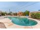 Poolside area features a covered patio, bar, table and chairs for outdoor entertaining at 6702 E Monte Vista Rd, Scottsdale, AZ 85257