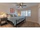 Cozy bedroom with ceiling fan, carpet, shuttered windows, and accent lamps at 6702 E Monte Vista Rd, Scottsdale, AZ 85257