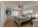 Cozy bedroom with shuttered windows, ceiling fan, and warm lighting, creating a comfortable ambiance at 6702 E Monte Vista Rd, Scottsdale, AZ 85257