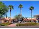 Attractive fountain with horse statues and well-maintained landscaping with red flowers at 6702 E Monte Vista Rd, Scottsdale, AZ 85257