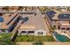 Backyard featuring a covered patio, green lawn, and inviting swimming pool at 6915 S Sapphire Way, Chandler, AZ 85249