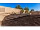 View of a spacious backyard featuring a block wall with landscaped planters along its upper border at 6915 S Sapphire Way, Chandler, AZ 85249