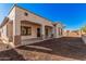 Backyard featuring a covered patio with neutral colored posts and concrete floor extending from the main house at 6915 S Sapphire Way, Chandler, AZ 85249