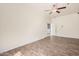 Spacious bedroom featuring wood-look tile floors and a ceiling fan at 6915 S Sapphire Way, Chandler, AZ 85249