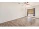 Unfurnished bedroom with tile floors, ceiling fan, and a window at 6915 S Sapphire Way, Chandler, AZ 85249