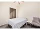 Cozy bedroom with a neutral color scheme, window, and ample natural light at 6915 S Sapphire Way, Chandler, AZ 85249