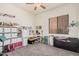 Bedroom with a large window, ample shelving, and carpeted floors at 6915 S Sapphire Way, Chandler, AZ 85249