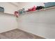 Walk-in closet with shelving and carpeted floor at 6915 S Sapphire Way, Chandler, AZ 85249