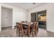 Dining area featuring a table set for eight and a sliding glass door to the outdoor pool area at 6915 S Sapphire Way, Chandler, AZ 85249