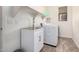 Functional laundry room with a stainless steel sink and modern washer at 6915 S Sapphire Way, Chandler, AZ 85249