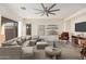 Staged living room featuring a neutral palette, stylish furniture, and modern decor accents at 6915 S Sapphire Way, Chandler, AZ 85249